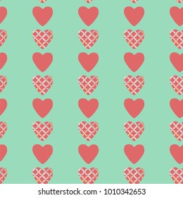 Seamless pattern with pink and red hearts. Decorative vector illustration.