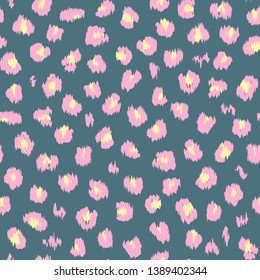 Seamless pattern with pink and yellow spots on a blue background. Leopard fur. Vector.