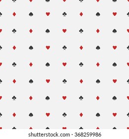 seamless pattern of playing card suits on white backdrop. vector background design. hearts, spades, diamonds and clubs symbol. casino and poker rooms wallpaper