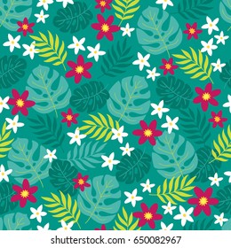 Seamless pattern with plumeria, palm leaves and tropical flowers on green background