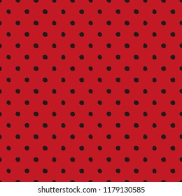 Seamless pattern in polka dot style black circles on hands on a red berry background.