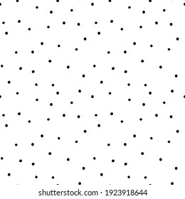 Seamless pattern with polka dots. Chaotic black dots on white background. Simple repeatable monochrome background.