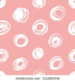 Seamless pattern with polka dots on a pink background.