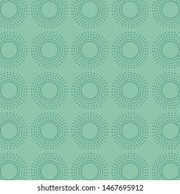 Seamless pattern, polka dots on green background.