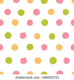 Seamless pattern with polka dots in pastel colors.