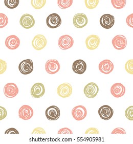 Seamless pattern with polka dots in pastel colors.
