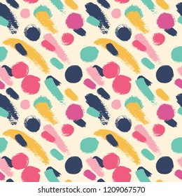 Seamless pattern with polka dots and strokes. Made bright mascara.
