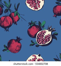Seamless pattern with pomegranates. Fruits on blue background. 
