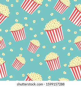 Seamless pattern of popcorn on blue background. Cinema concept 