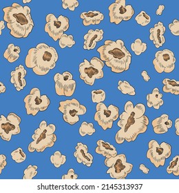 Seamless pattern with popcorn. Vintage style pop corn fluffy flakes on blue background