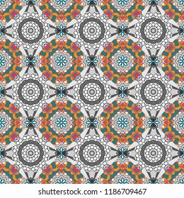 Seamless pattern with the pre-existing geometry in the drawing. Tribal ethnic arabic, indian, turkish patern ornament. Vector traditional oriental background in orange, gray and blue colors.