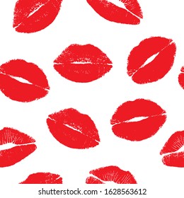 Seamless pattern with prints of female lips. Traces of red lipstick on a white background. Kisses isolated on a white background. Suitable for fabric print,  romantic greeting card or wrapping.