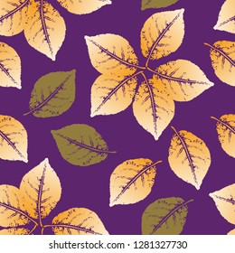 Seamless pattern of the prints of the leaves of living plants. Gold and green leaves on purple background. Vector.