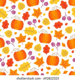 Seamless pattern with pumpkin, flowers, oak and maple leaves on white background. Perfect for wallpaper, gift paper, autumn greeting cards.