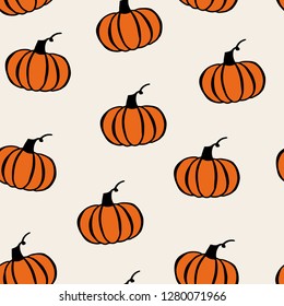 Seamless pattern with pumpkin hand drawings on beige background.  Vector illustration.