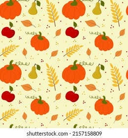 Seamless pattern with pumpkin, pear, apple and branch of leaves. Scrapbook, gift wrapping paper, textiles.