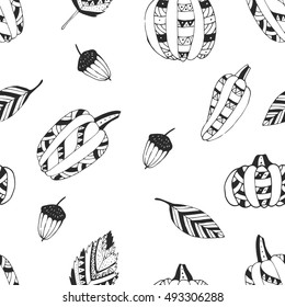 Seamless pattern with pumpkins, acorns, leaves. Hand drawn doodle. Vector illustration