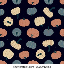 Seamless pattern of pumpkins and dots on a dark blue background. vector illustration 