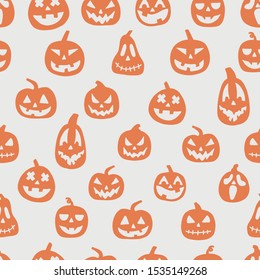 Seamless pattern of pumpkins. Halloween pumpkin faces on white background. Hand drawn vector illustration 