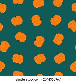 Seamless pattern of pumpkins on emerald color background. Background for autumn decorative design
