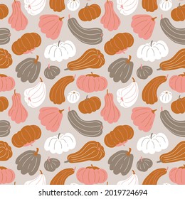 Seamless pattern with pumpkins in pastel color palette. Vector Halloween texture in flat style on light grey background. Halloween pumpkin repeated background.