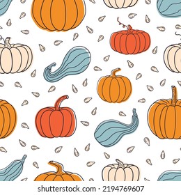 Seamless pattern with pumpkins and seeds. Doodle-style pumpkins. Autumn illustration. Vector image.