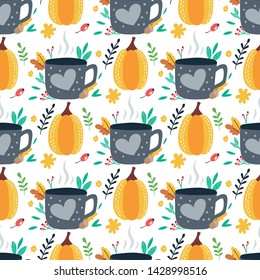 Seamless pattern with pumpkins, tea cup and leaves on a white background. Vector design for wrapping paper, textile. 
