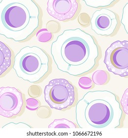 seamless pattern in purple colors with tea cups and macaroons