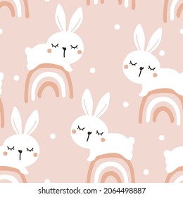 Seamless pattern with rabbit cartoons and hand drawn rainbows on pink background vector illustration. Cute childish print.