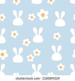 Seamless pattern with rabbit head cartoons and daisy flower on blue background vector illustration.