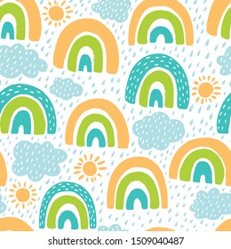 Seamless pattern with rainbow and clouds on a white background..