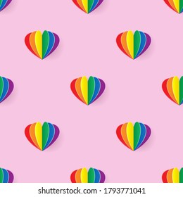 Seamless pattern with rainbow heart paper art style on light pink background, Vector illustration