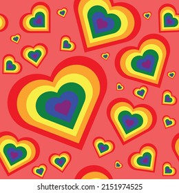 Seamless pattern with rainbow hearts on pink background. Gay pride, LGBT community symbol . Repeat wrapping texture for fabric, wallpaper or gift wrap.