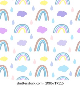 Seamless pattern with rainbows and clouds in Scandinavian style. Boho pattern for the nursery.Hand drawn rainbow vector