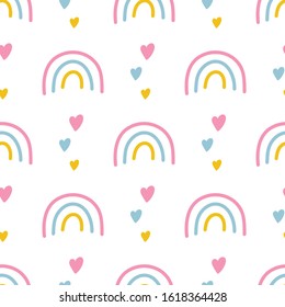Seamless pattern of rainbows and hearts on a white background.