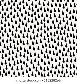 Seamless pattern with raindrops in black on cream background.