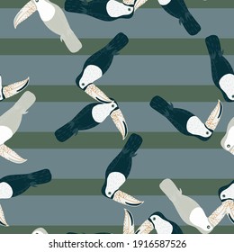 Seamless pattern with random doodle toucan bird shapes in kids style. Striped pale blue background. Flat vector print for textile, fabric, giftwrap, wallpapers. Endless illustration.