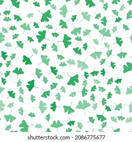 Seamless pattern of random green ginkgo biloba leaves