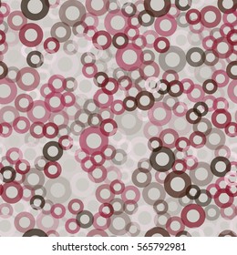 Seamless pattern of randomly positioned rings. Chaotic spread. Fashion camouflage.