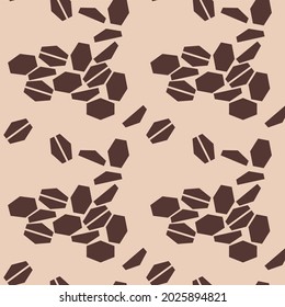 Seamless pattern of randomly scattered coffee beans in a flat graphic style. Geometric abstract shapes imitating coffee beans.