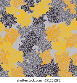 Seamless pattern. Randomly spaced colored spots. A chaotic mesh in the foreground. Fashionable camouflage. Yellow and gray tones.