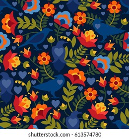 Seamless pattern with raven, symbols of the heart and flowers. Background with flat shapes in blue, green, red, orange and yellow colors. Texture in ethno style. Vector illustration.