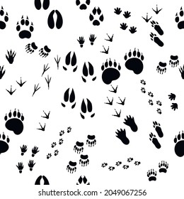 Seamless pattern of realistic footprints of forest wild animals on a white background. Vector illustration.