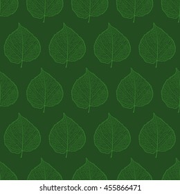 Seamless pattern with realistic silhouettes of linden leaves. Light green leaves on a dark green background