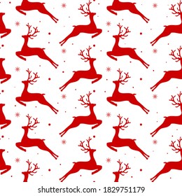 Seamless pattern with red deers and snowflakes. Christmas print for clothing, kitchen textiles and wrapping paper.