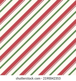 Patrón sin foco con rayas rojas, verdes y blancas. Patrón diagonal rayado para Navidad. Clásicas rayas de caña de caramelo.