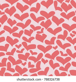 Seamless pattern with red hearts on a light pink background. You can use as a backdrop for the site for Valentine's Day or for printing on fabric or wrapping paper