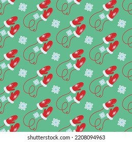 Seamless pattern with red mittens and snowflakes. Festive background for packaging, fabrics and any designs. Vector illustration in a flat style.