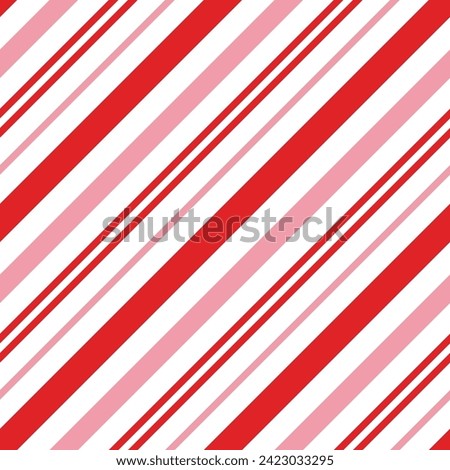 Seamless pattern with red and pink candy cane stripes. Christmas packaging print.