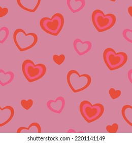 Patrón sin foco con corazones rojos y rosados. Gráficos vectoriales.
